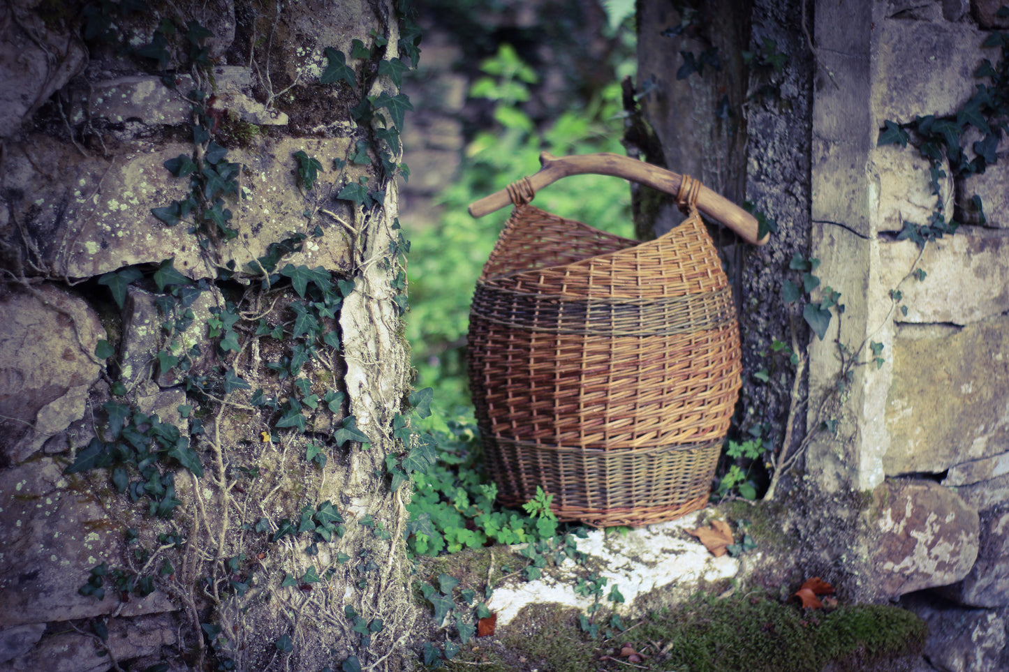 Assymetric basket with stick handle.